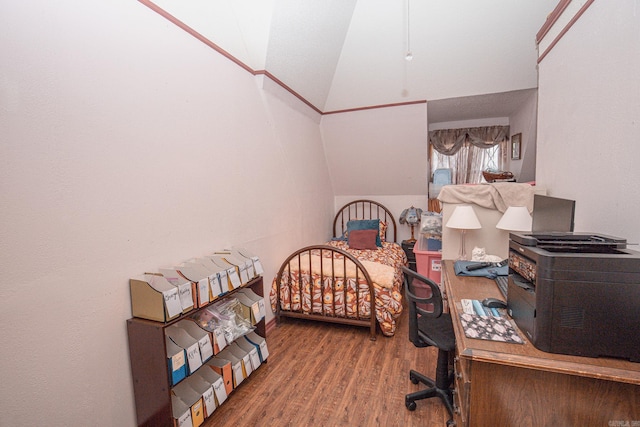 bedroom featuring wood-type flooring and lofted ceiling