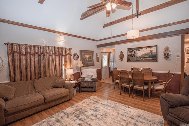 living room featuring beam ceiling, ceiling fan, light hardwood / wood-style flooring, and high vaulted ceiling