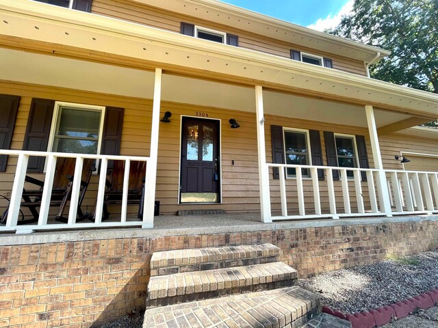 entrance to property with a porch