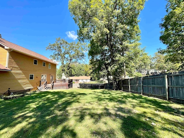 view of yard with a wooden deck