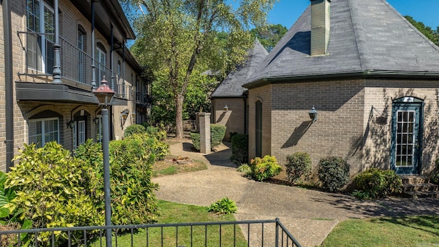 view of home's exterior with a balcony