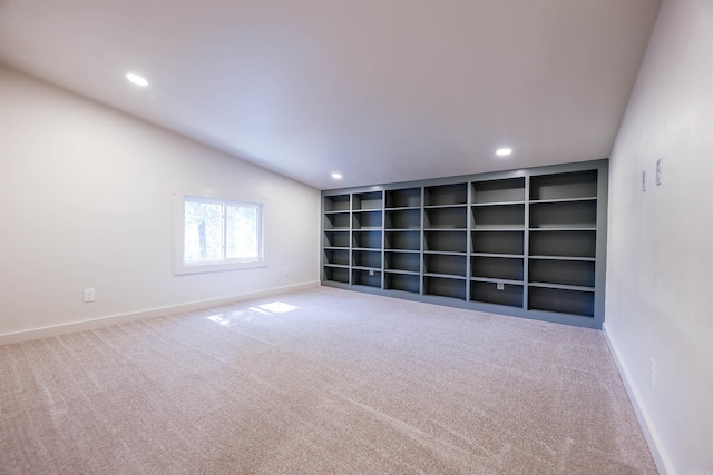 carpeted spare room featuring built in features