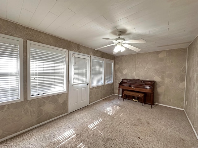 misc room with ceiling fan and carpet