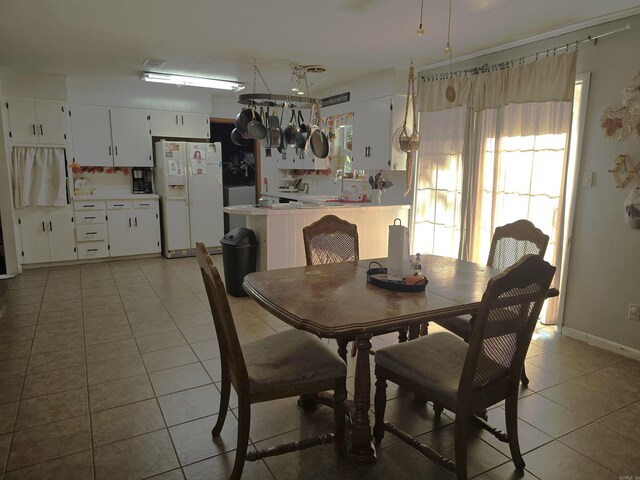 dining area with light tile patterned floors