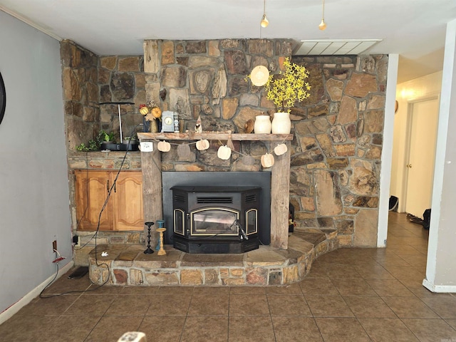 interior details featuring a wood stove and tile patterned floors