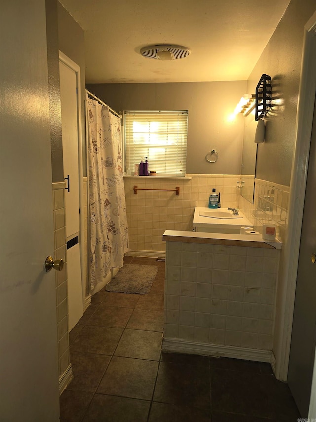 bathroom featuring a shower with curtain, vanity, tile walls, and tile patterned floors