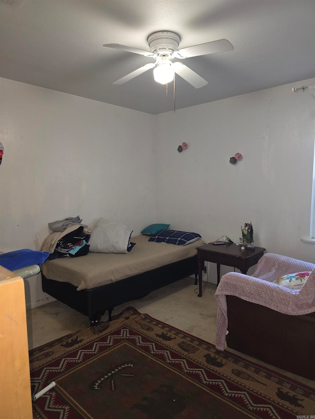 bedroom with ceiling fan and carpet floors