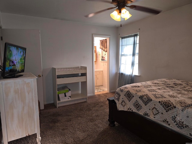 carpeted bedroom featuring ensuite bath and ceiling fan