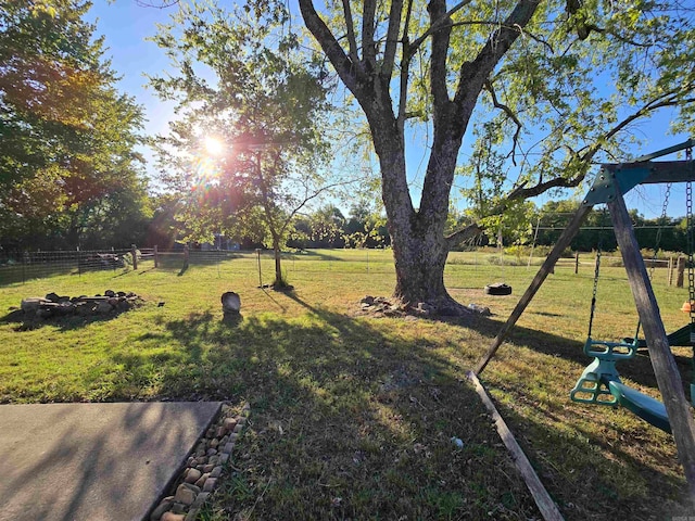 view of yard with a rural view