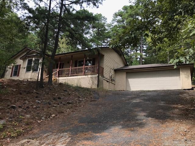 view of front of house with a garage and covered porch