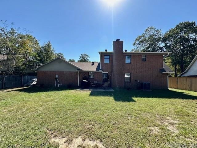 back of property featuring a yard and cooling unit