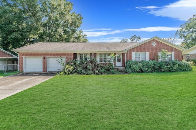 single story home with a garage and a front lawn