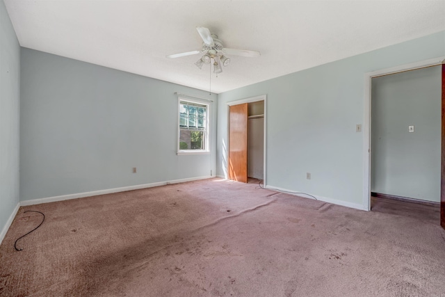 unfurnished room featuring carpet floors and ceiling fan