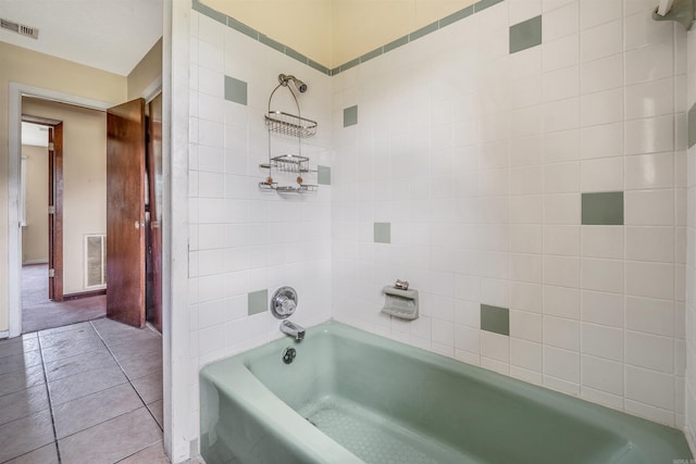 bathroom featuring tiled shower / bath combo and tile patterned floors