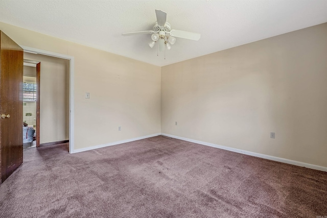 carpeted empty room featuring a textured ceiling and ceiling fan