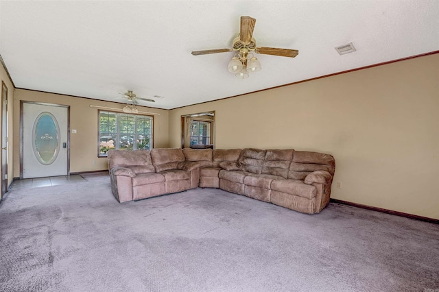 living room with ceiling fan and light colored carpet