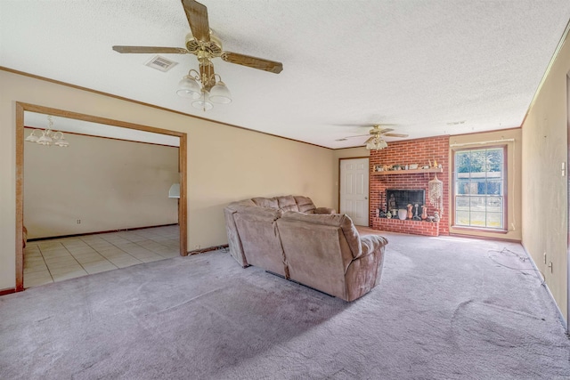 unfurnished living room featuring a textured ceiling, ceiling fan with notable chandelier, light colored carpet, and a brick fireplace