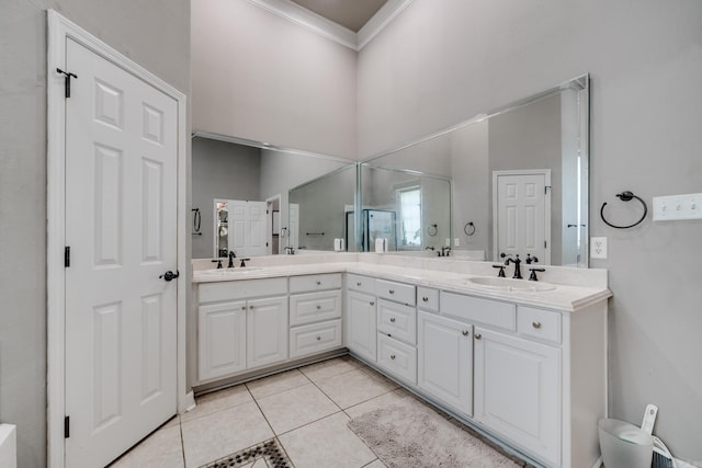 bathroom featuring walk in shower, ornamental molding, tile patterned flooring, and vanity