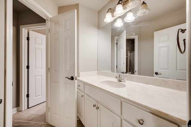 bathroom with tile patterned flooring and vanity