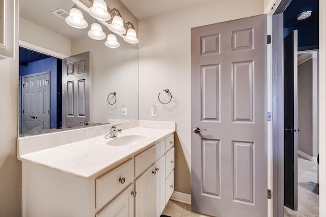 bathroom with tile patterned flooring and vanity