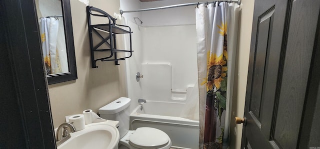 full bathroom featuring shower / bath combo with shower curtain, sink, and toilet