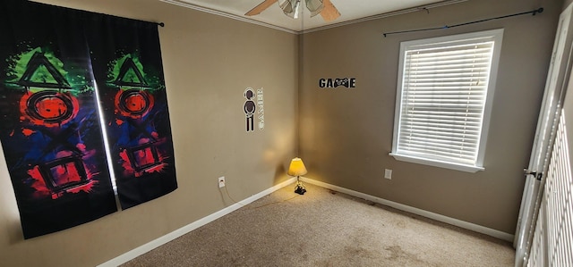 unfurnished bedroom featuring ornamental molding, carpet, and ceiling fan