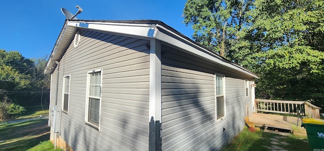 view of side of home featuring a deck