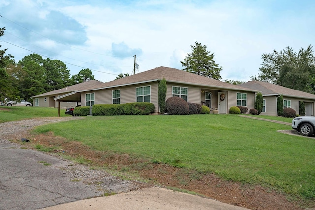 ranch-style home with a front yard and a carport