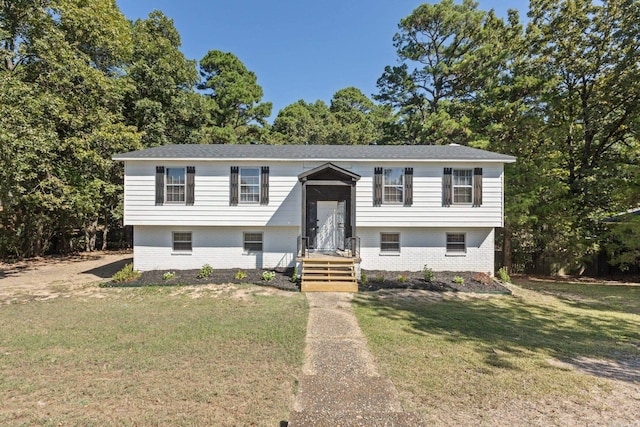 bi-level home with a front yard