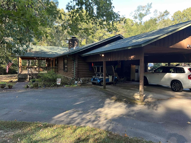 view of side of property featuring a carport