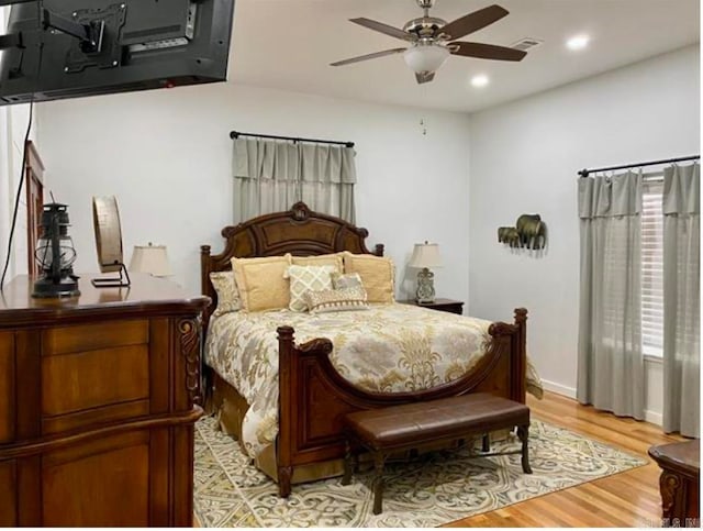 bedroom with light wood-type flooring and ceiling fan