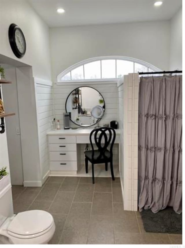 bathroom featuring toilet and tile patterned floors