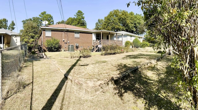 rear view of property with cooling unit