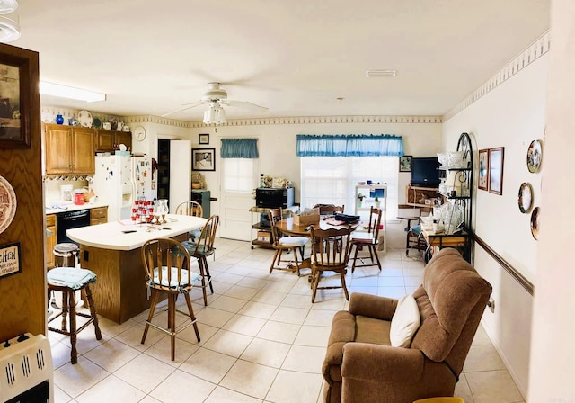 dining room with light tile patterned flooring and ceiling fan