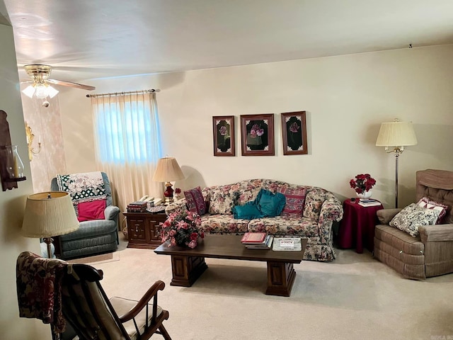 living room featuring ceiling fan and light colored carpet