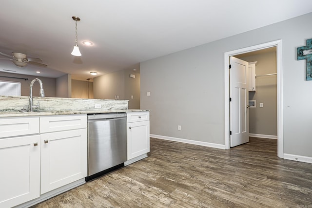 kitchen featuring white cabinetry, dark hardwood / wood-style flooring, pendant lighting, stainless steel dishwasher, and sink