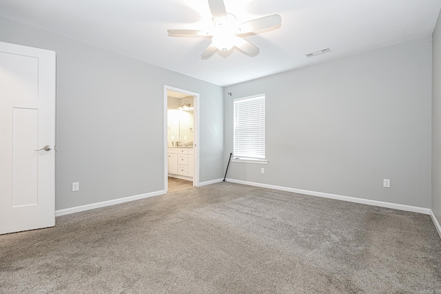 empty room featuring ceiling fan and carpet flooring