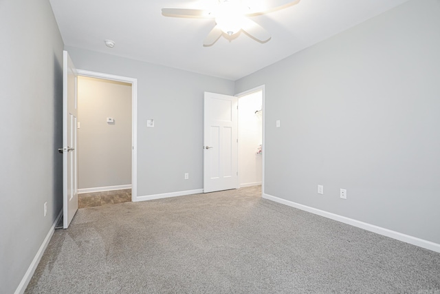 unfurnished bedroom with ceiling fan and carpet flooring