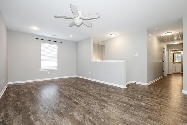 empty room featuring ceiling fan and dark hardwood / wood-style floors