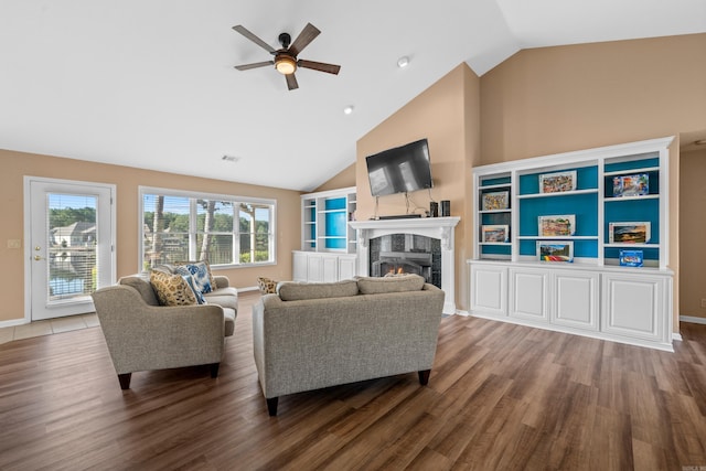 living room featuring hardwood / wood-style floors, ceiling fan, and high vaulted ceiling