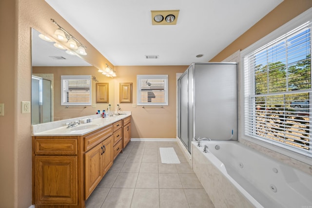 bathroom with independent shower and bath, vanity, and tile patterned floors