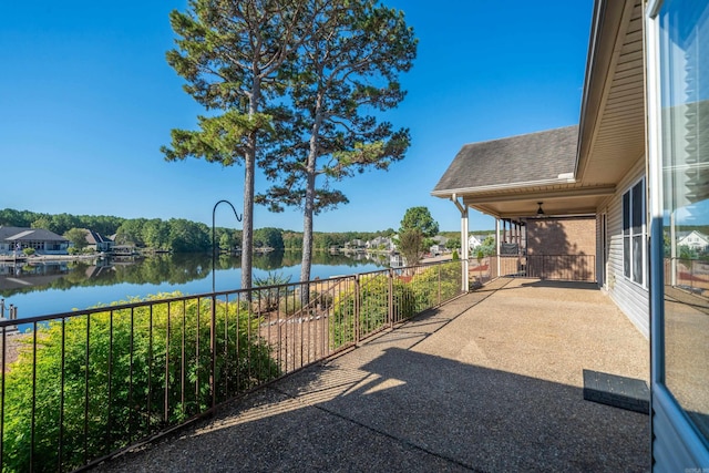 view of patio / terrace with a water view and ceiling fan