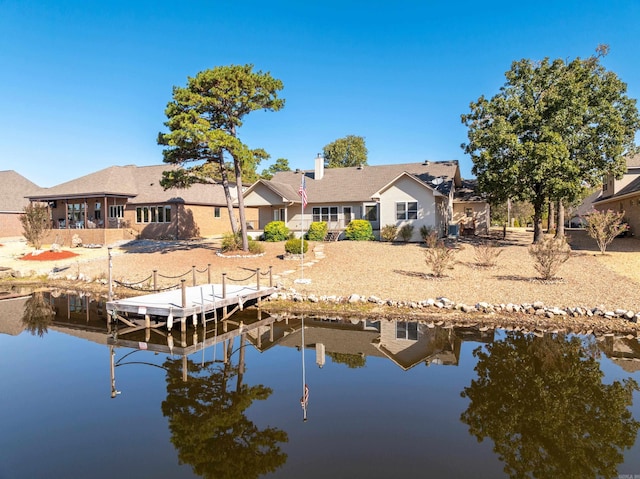 back of house with a water view