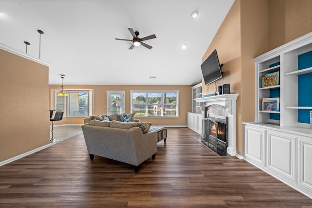 living room featuring ceiling fan, dark wood-type flooring, and high vaulted ceiling