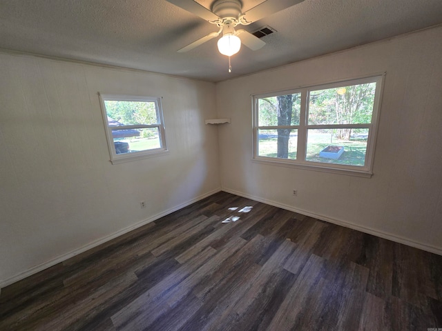 unfurnished room featuring a textured ceiling, dark hardwood / wood-style flooring, and ceiling fan