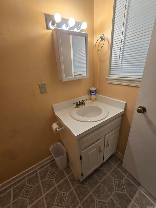 bathroom with tile patterned floors and vanity