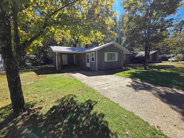 ranch-style home with a front lawn and a carport