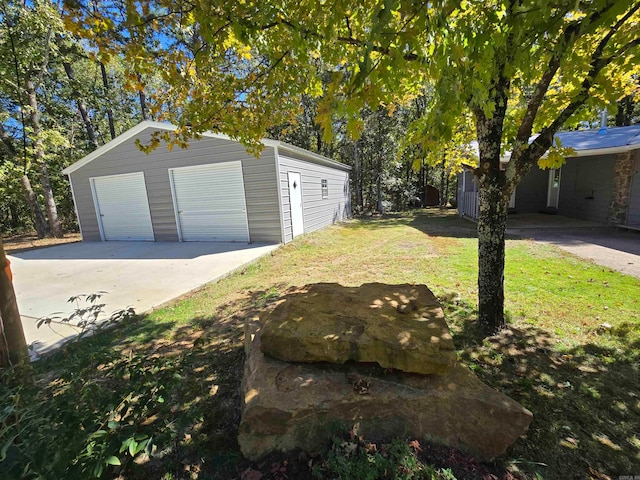 garage featuring a yard