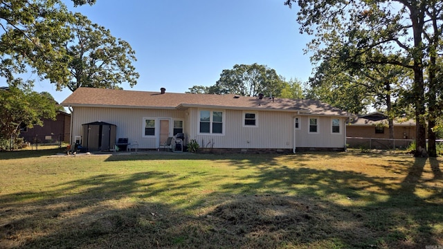 back of house with a yard