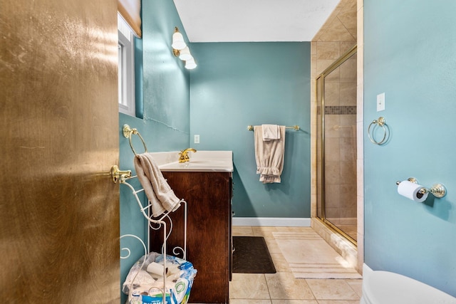 bathroom with tile patterned floors, vanity, toilet, and walk in shower